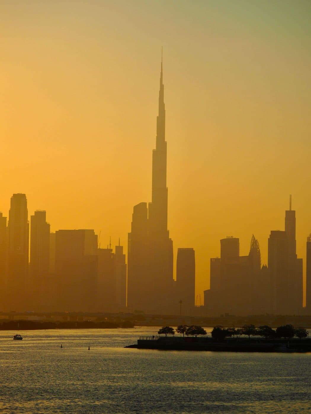 Burj Khalifa and the Downtown Dubai skyline at sunset